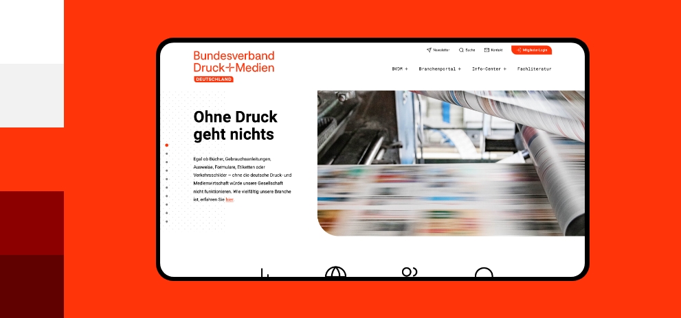 Screenshot einer Desktopansicht der Webseite Verband Druck und Medien umgeben von den Farben des Corporate Design